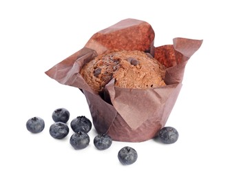 Photo of Delicious sweet muffin with chocolate chips and blueberries isolated on white