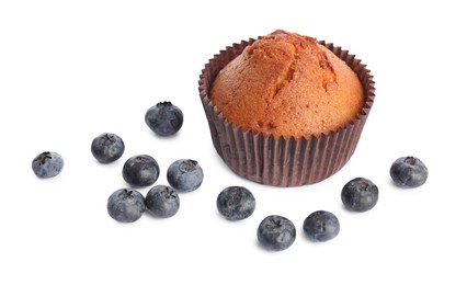 Photo of Delicious sweet muffin and blueberries isolated on white