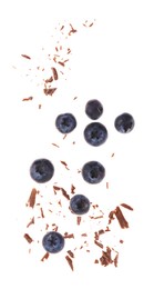 Photo of Fresh blueberries and crushed chocolate pieces isolated on white