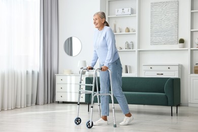 Senior woman with walking frame at home