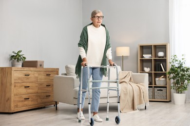 Senior woman with walking frame at home