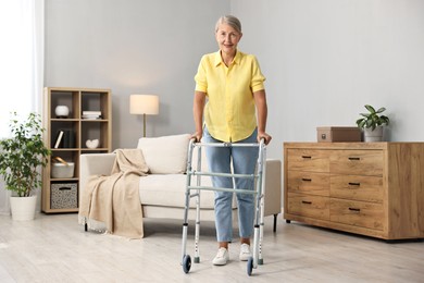 Senior woman with walking frame at home