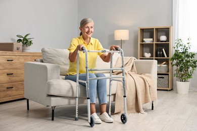 Photo of Senior woman with walking frame on sofa at home