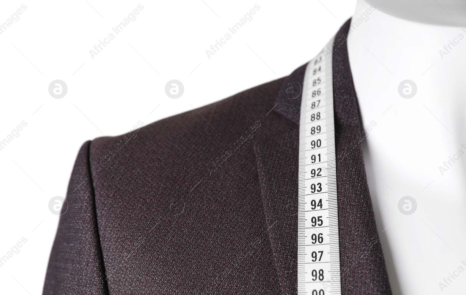 Photo of Mannequin with jacket and measuring tape isolated on white, closeup