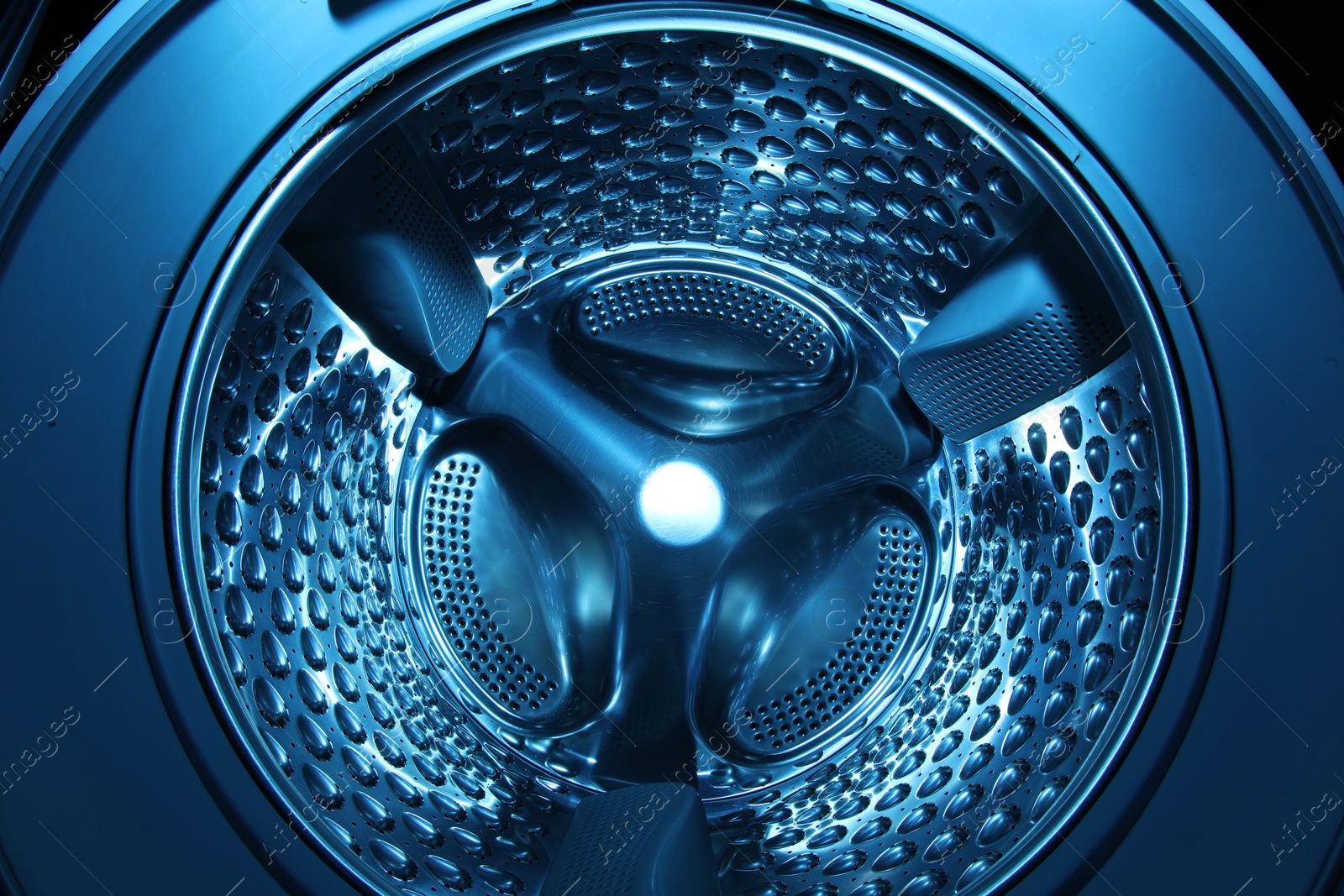 Photo of Washing machine with empty drum as background, closeup