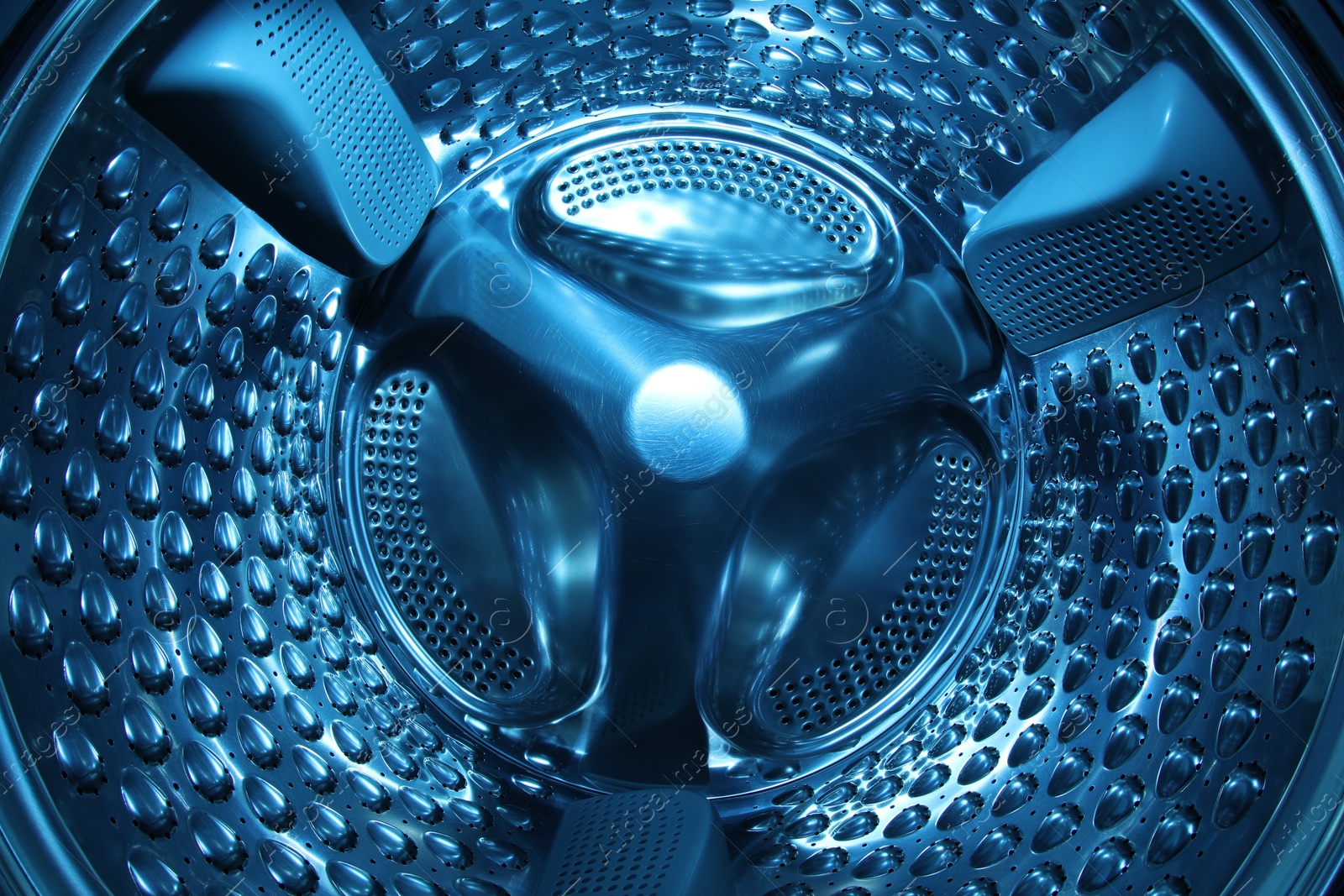 Photo of Washing machine with empty drum as background, closeup