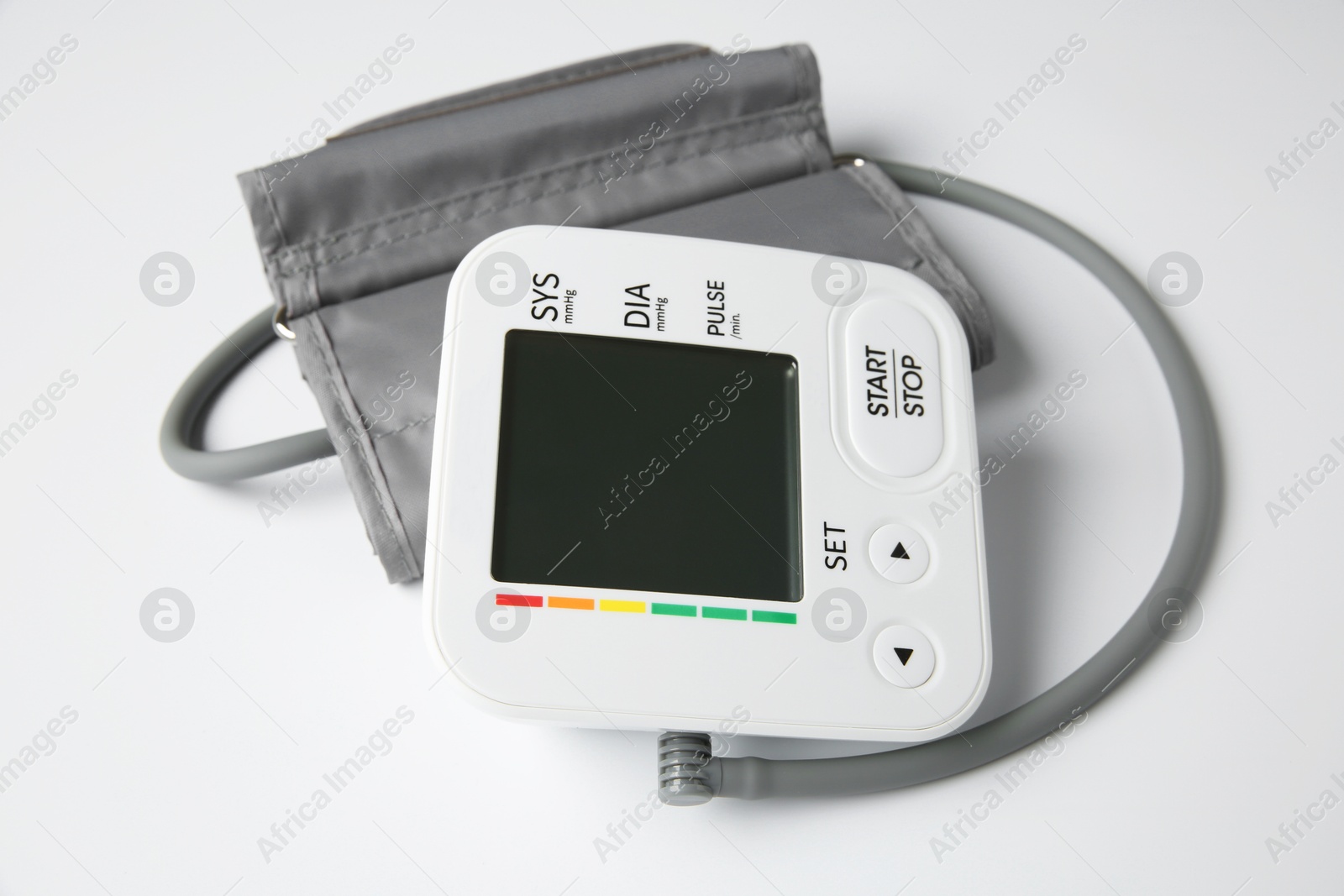 Photo of Blood pressure measuring device on white background, closeup