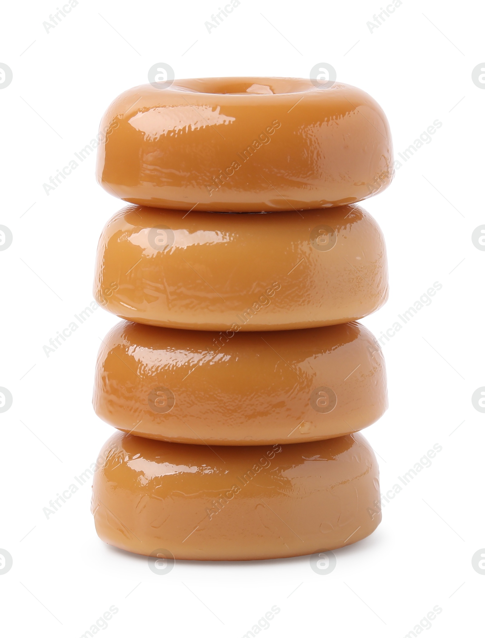 Photo of Stack of tasty hard toffee candies isolated on white