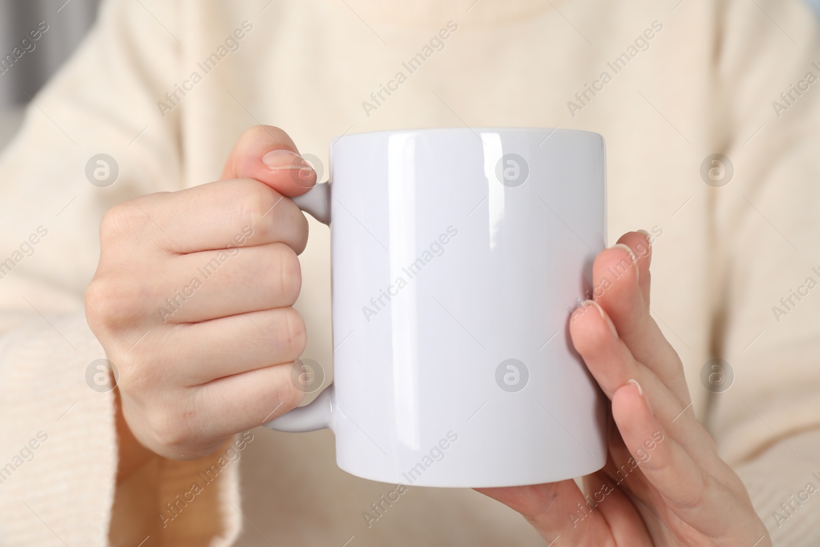 Photo of Woman with white ceramic cup, closeup. Mockup for design