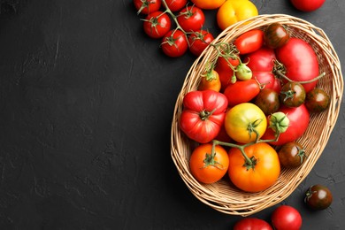 Photo of Different ripe and unripe tomatoes on grey textured table, flat lay. Space for text