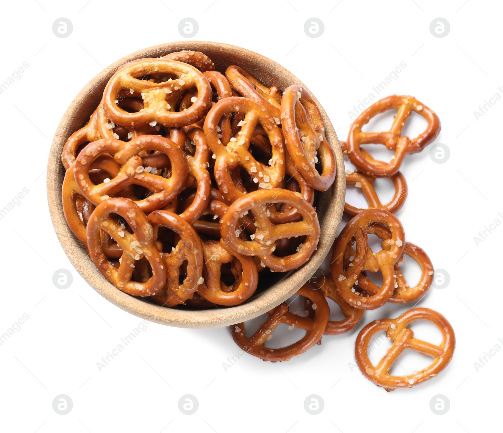 Photo of Delicious pretzel crackers in bowl isolated on white, top view