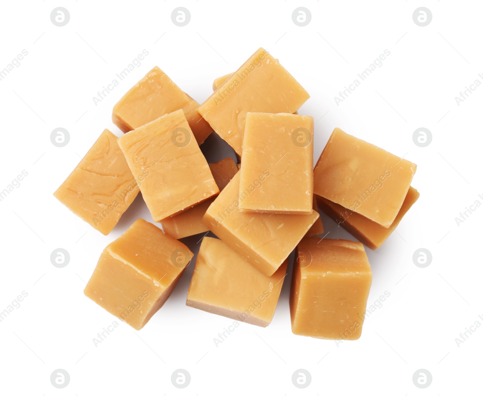 Photo of Tasty sweet caramel candies isolated on white, top view