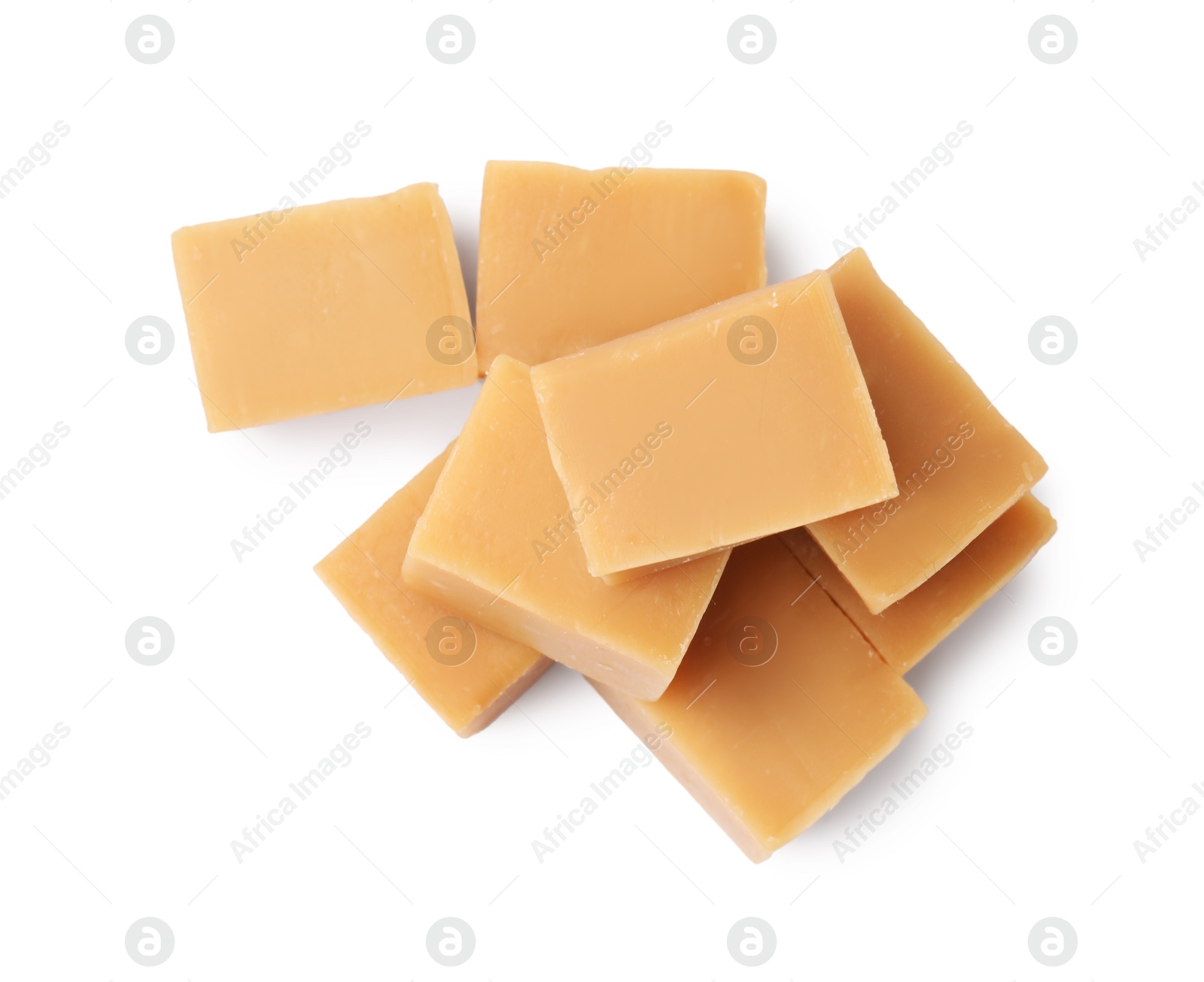 Photo of Tasty sweet caramel candies isolated on white, top view