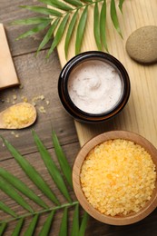 Photo of Spa composition with different cosmetic products on wooden table, flat lay