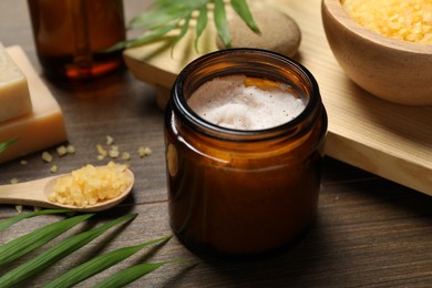 Spa composition with different cosmetic products on wooden table, closeup