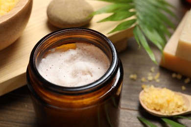 Photo of Spa composition with different cosmetic products on wooden table, closeup