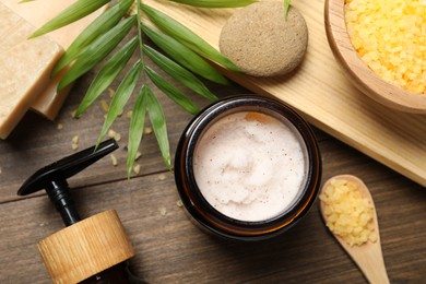 Spa composition with different cosmetic products on wooden table, flat lay