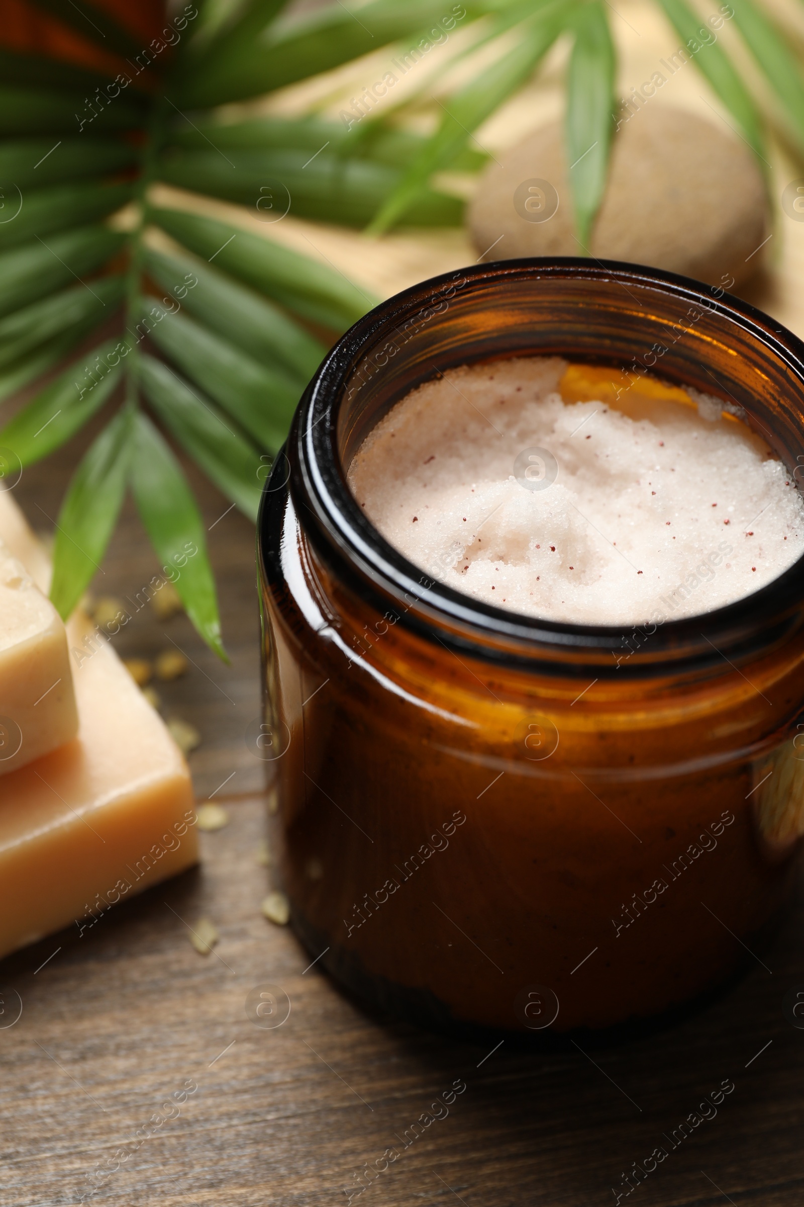 Photo of Spa composition with different cosmetic products on wooden table, closeup