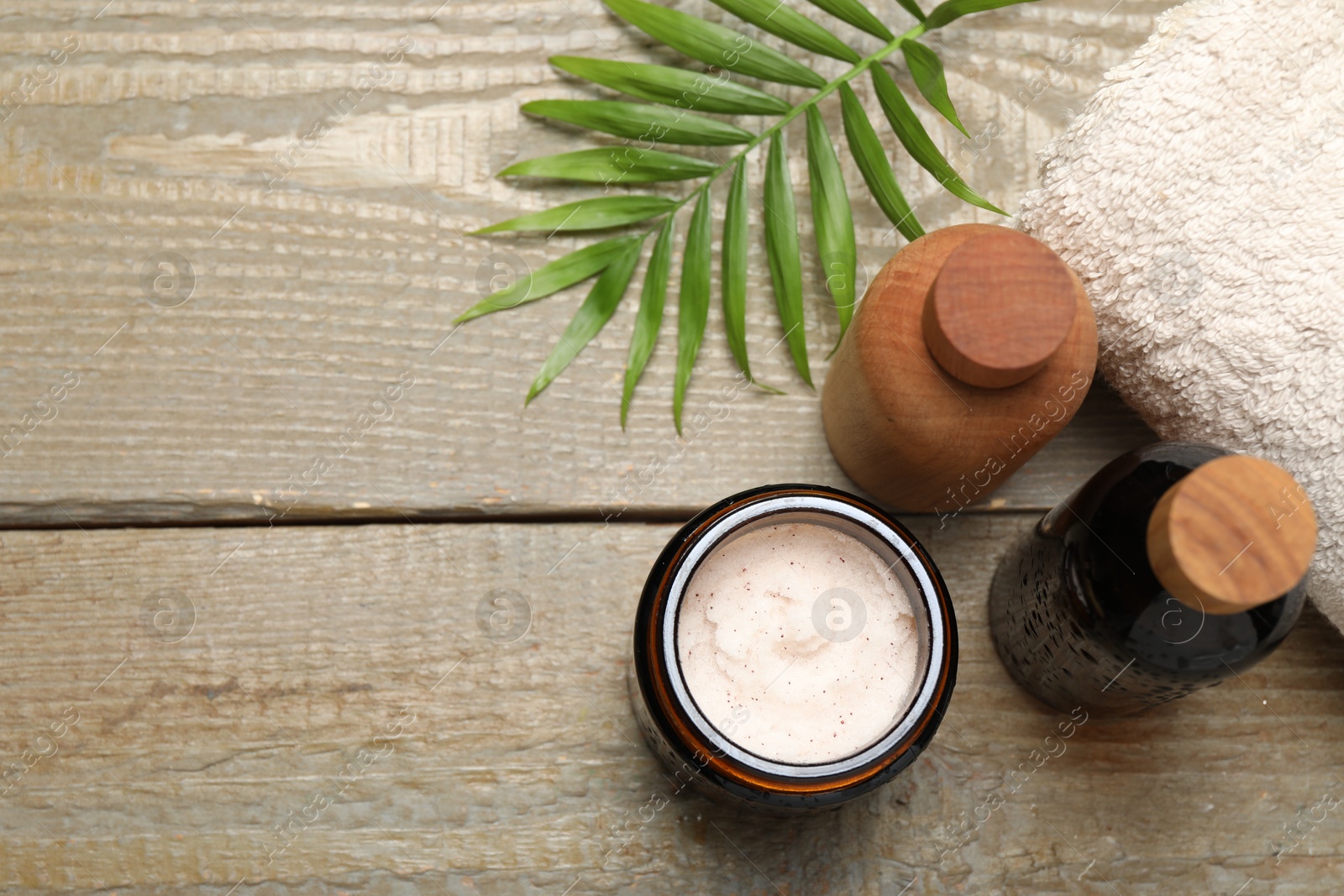 Photo of Spa composition with different cosmetic products on wooden table, flat lay. Space for text