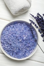 Photo of Spa composition with sea salt, towel and lavender flowers on white wooden table, flat lay