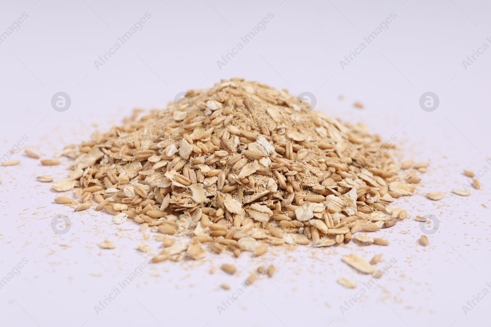 Photo of Oat bran, grains and flakes on white background