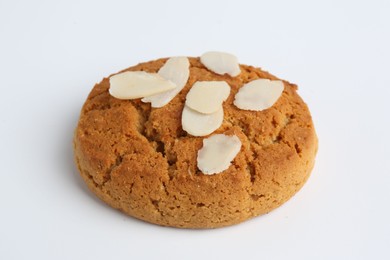 Photo of One tasty cookie with almond flakes on white background