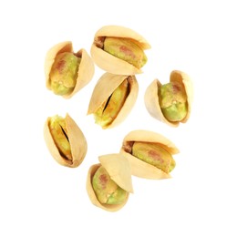 Image of Tasty pistachios in air on white background