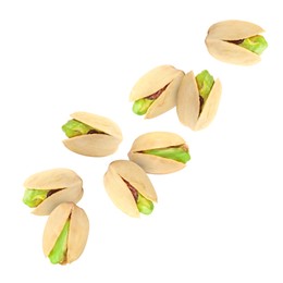 Image of Tasty pistachios in air on white background