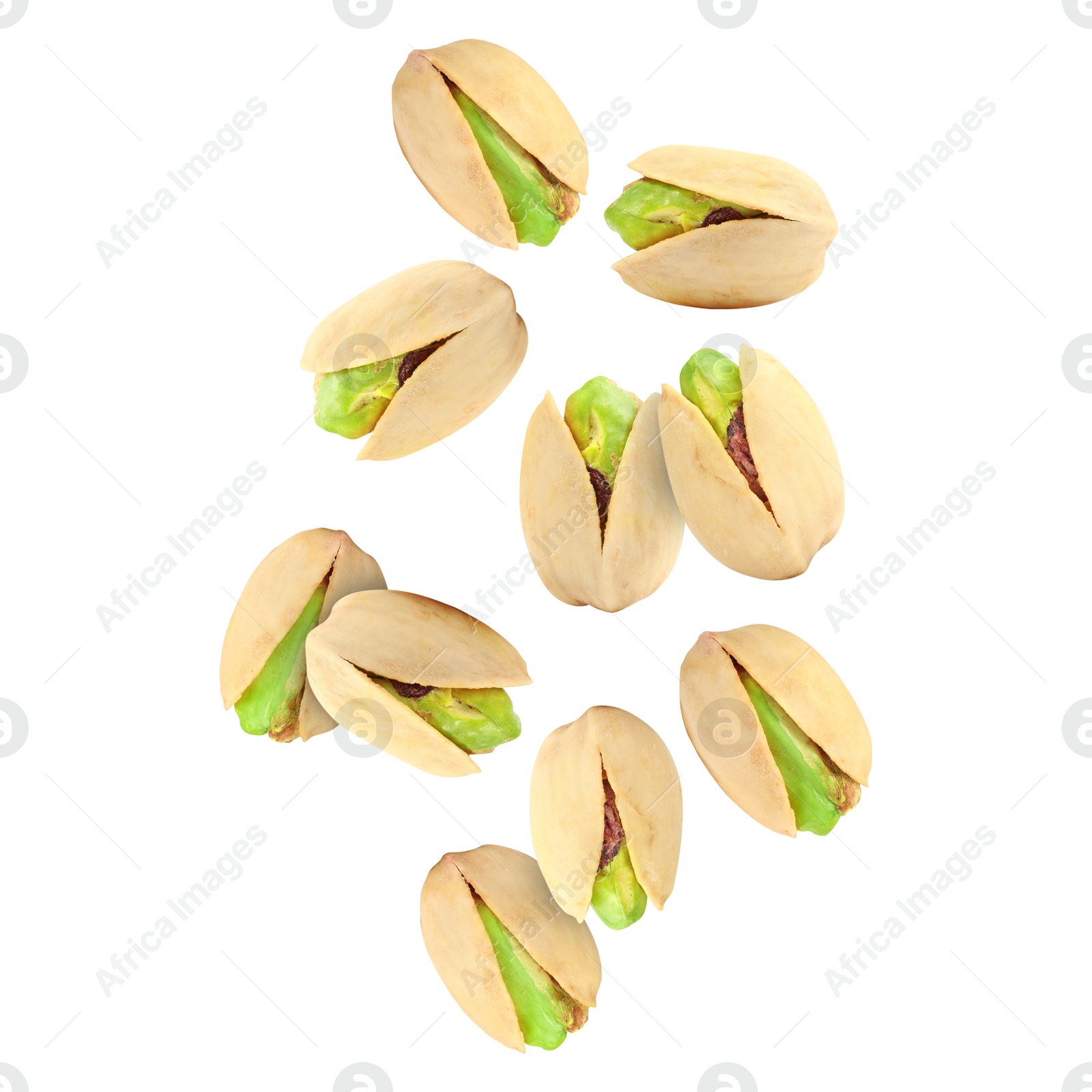 Image of Tasty pistachios in air on white background