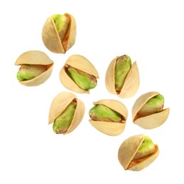 Image of Tasty pistachios in air on white background