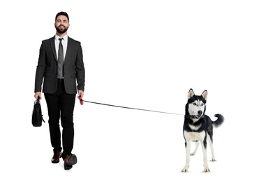 Image of Happy businessman walking his dog on white background