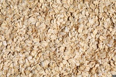 Photo of Pile of oat flakes as background, top view