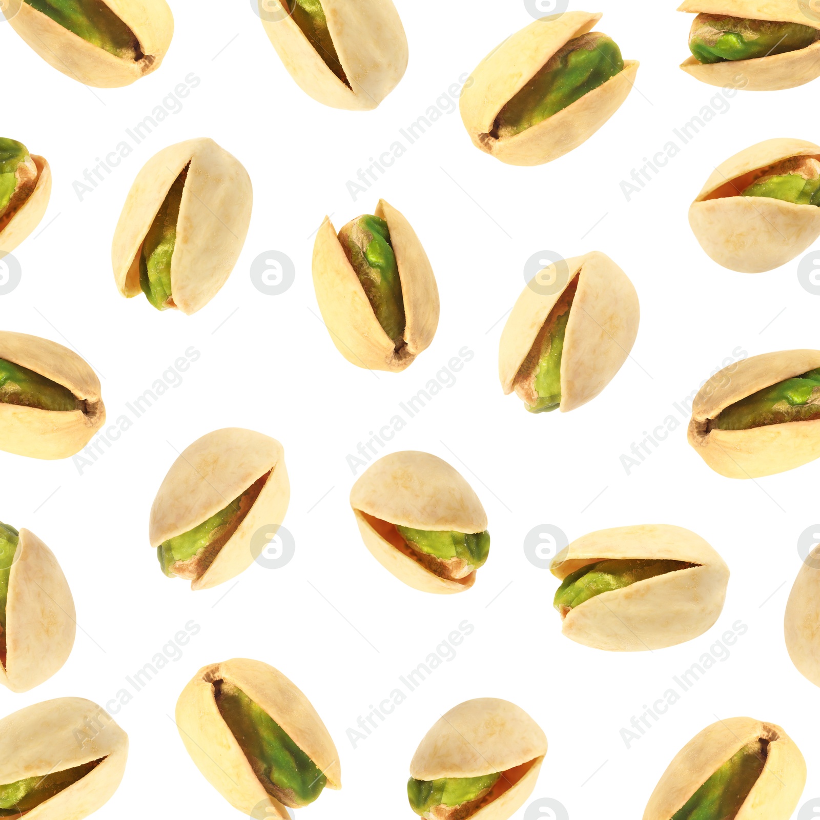 Image of Tasty pistachios in air on white background