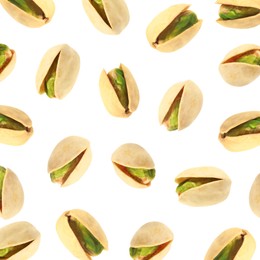 Image of Tasty pistachios in air on white background