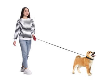 Image of Happy woman walking her dog on white background