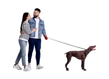 Happy couple walking their dog on white background