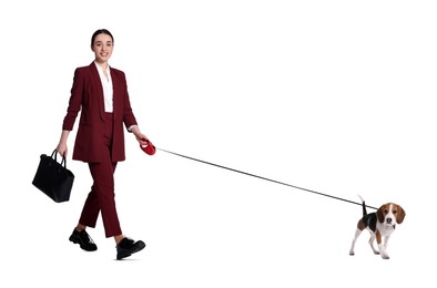 Happy businesswoman walking her dog on white background