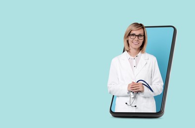 Image of Online medical consultation. Doctor with stethoscope on smartphone screen against light blue background, space for text