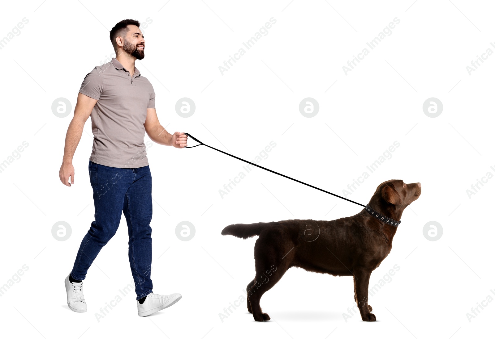 Image of Happy man walking his dog on white background