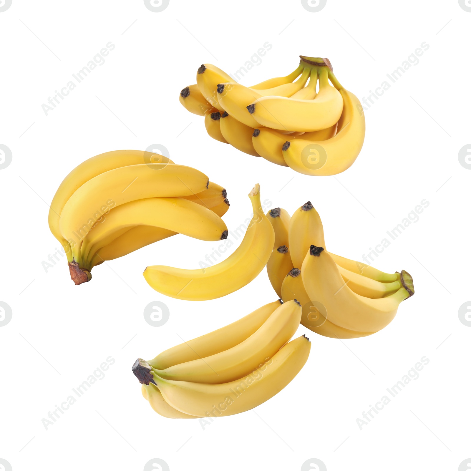 Image of Many yellow bananas in air on white background