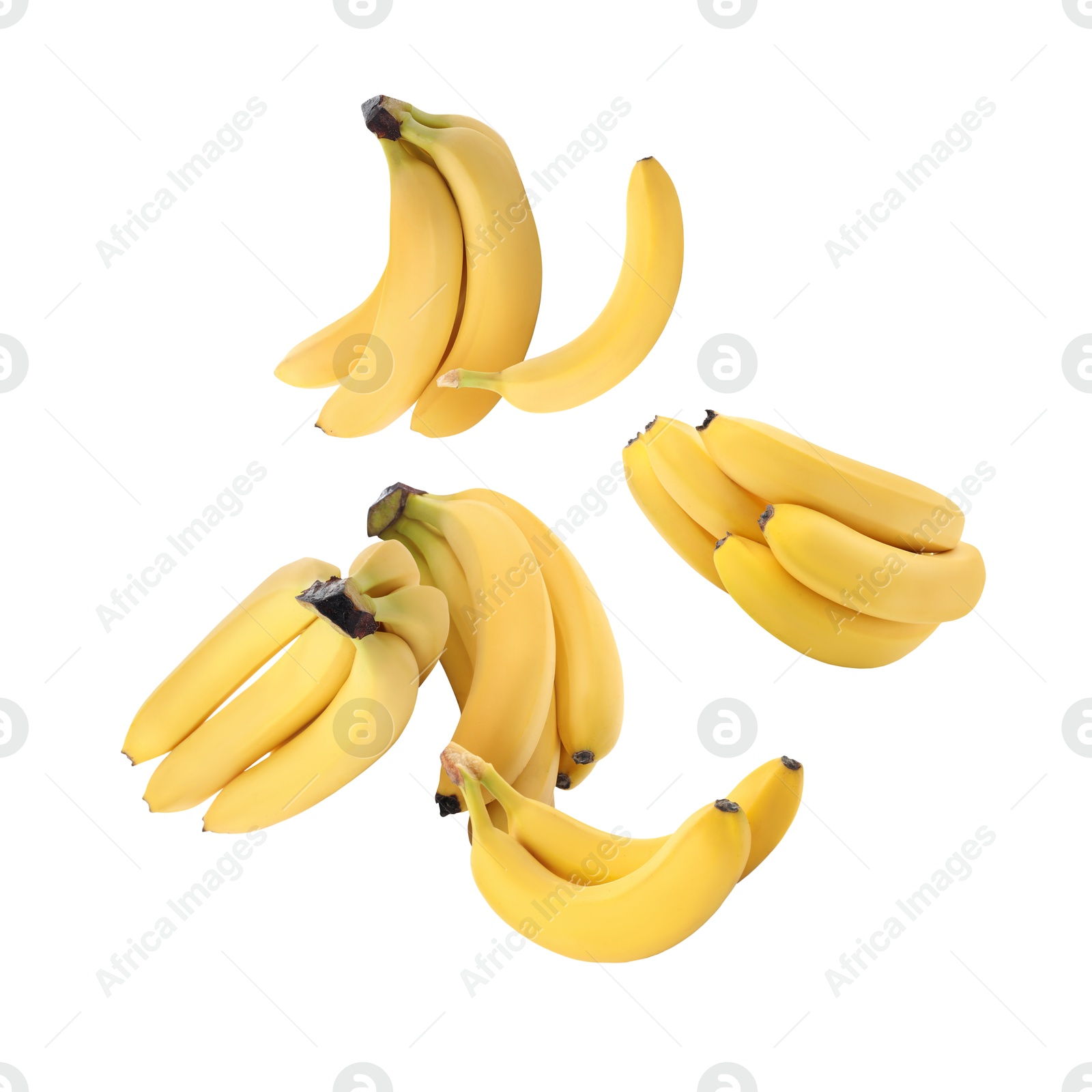 Image of Many yellow bananas in air on white background