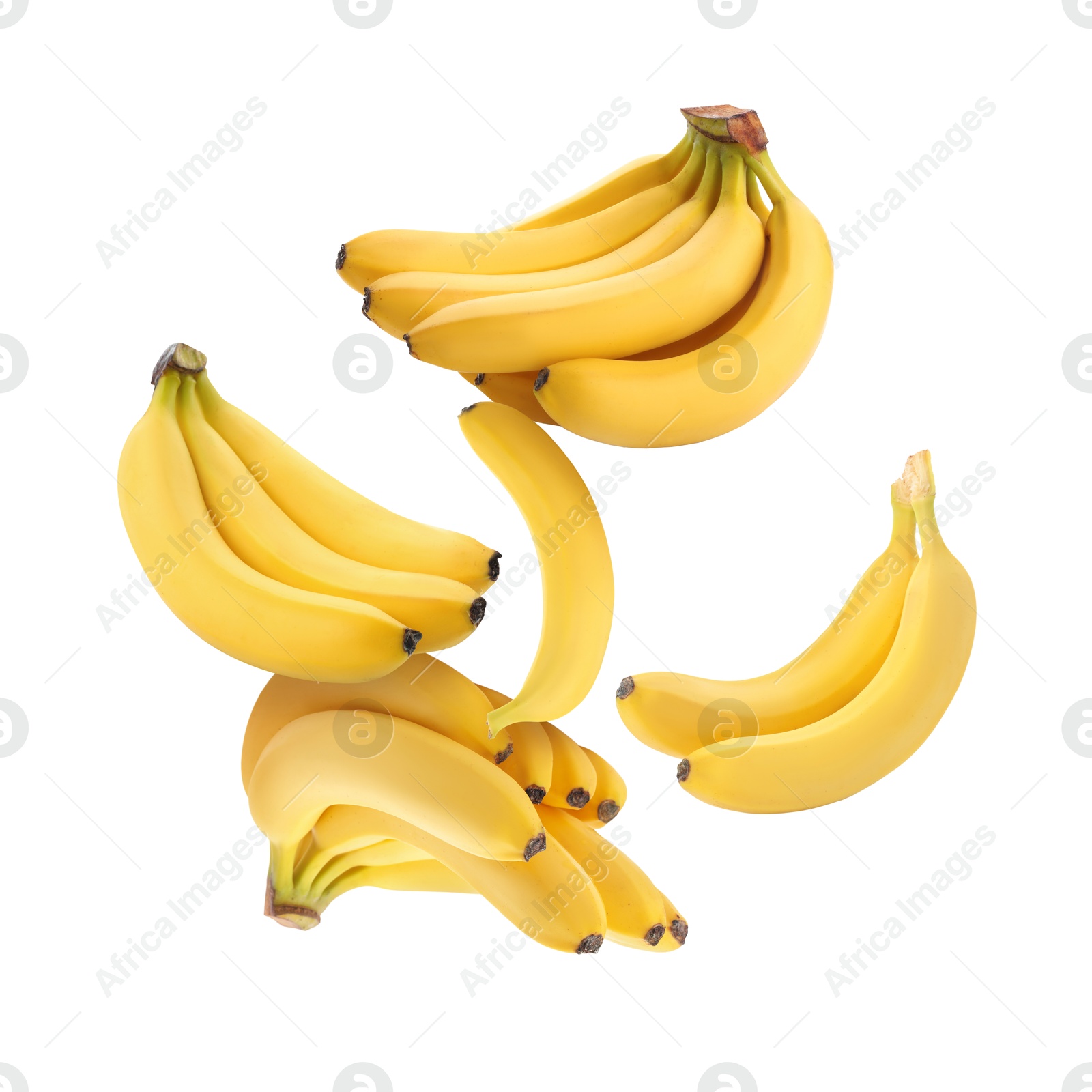 Image of Many yellow bananas in air on white background