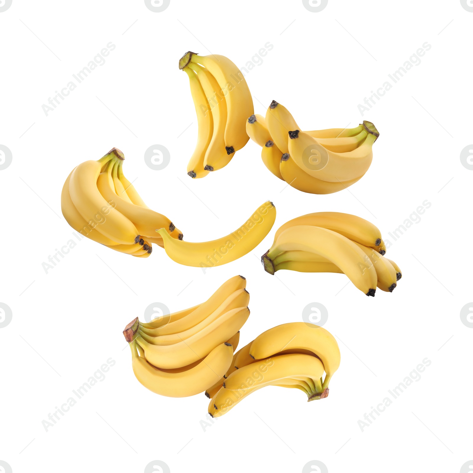 Image of Many yellow bananas in air on white background