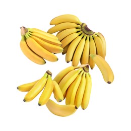 Many yellow bananas in air on white background