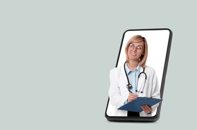 Online medical consultation. Doctor with clipboard on smartphone screen against light grey background, space for text