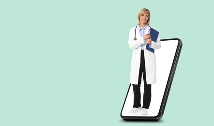 Image of Online medical consultation. Doctor with clipboard on smartphone screen against light blue background. Banner design with space for text