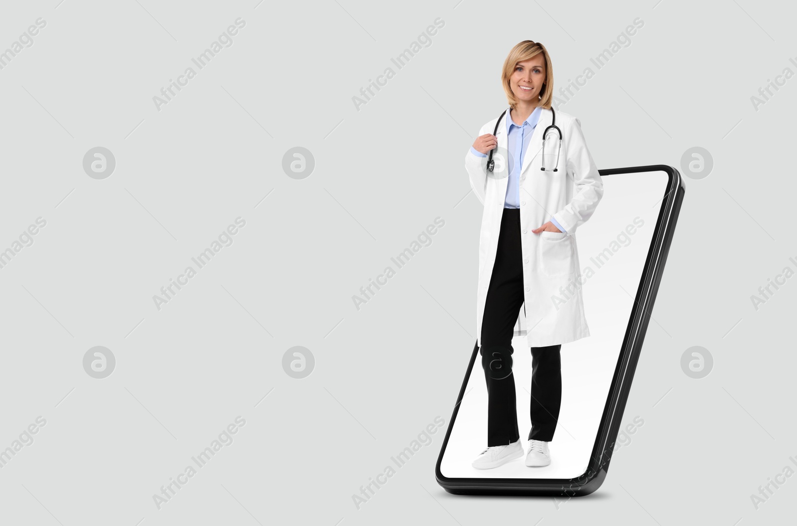 Image of Online medical consultation. Doctor on smartphone screen against light grey background, space for text