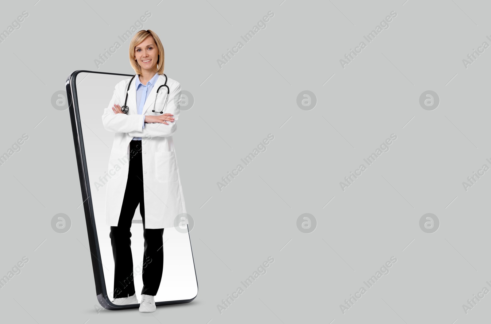 Image of Online medical consultation. Doctor on smartphone screen against light grey background, space for text