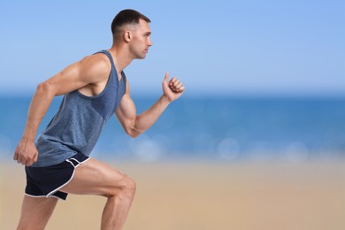 Sporty man running on beach. Space for text