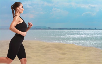 Beautiful woman running on beach. Space for text